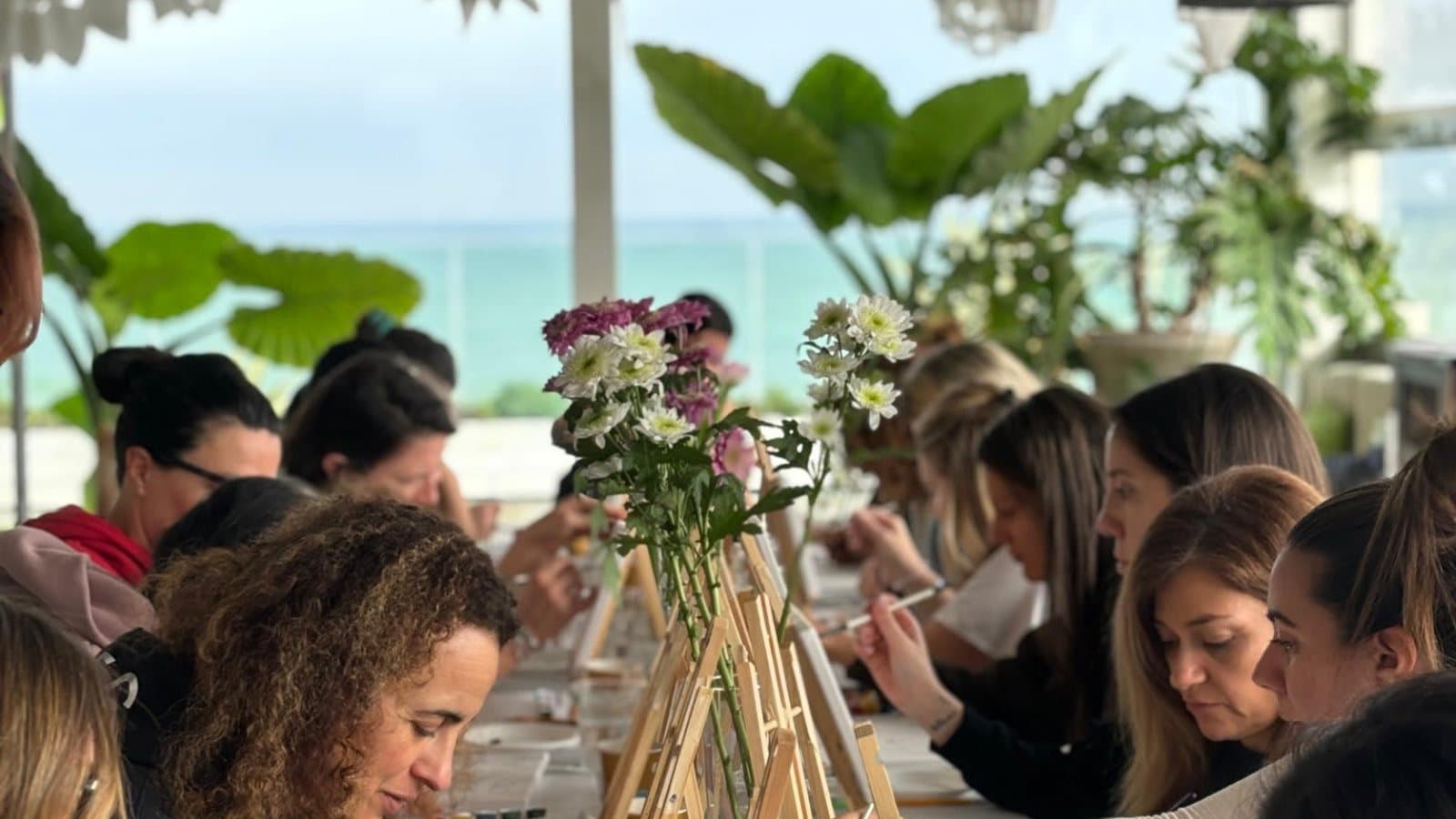 Friends celebrating together at a private artisan workshop